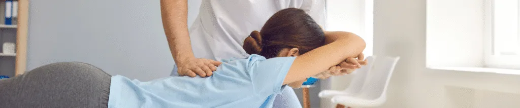 Chiropractor Giving Final Advice to a Patient at the End of a Treatment Session in a Clinic